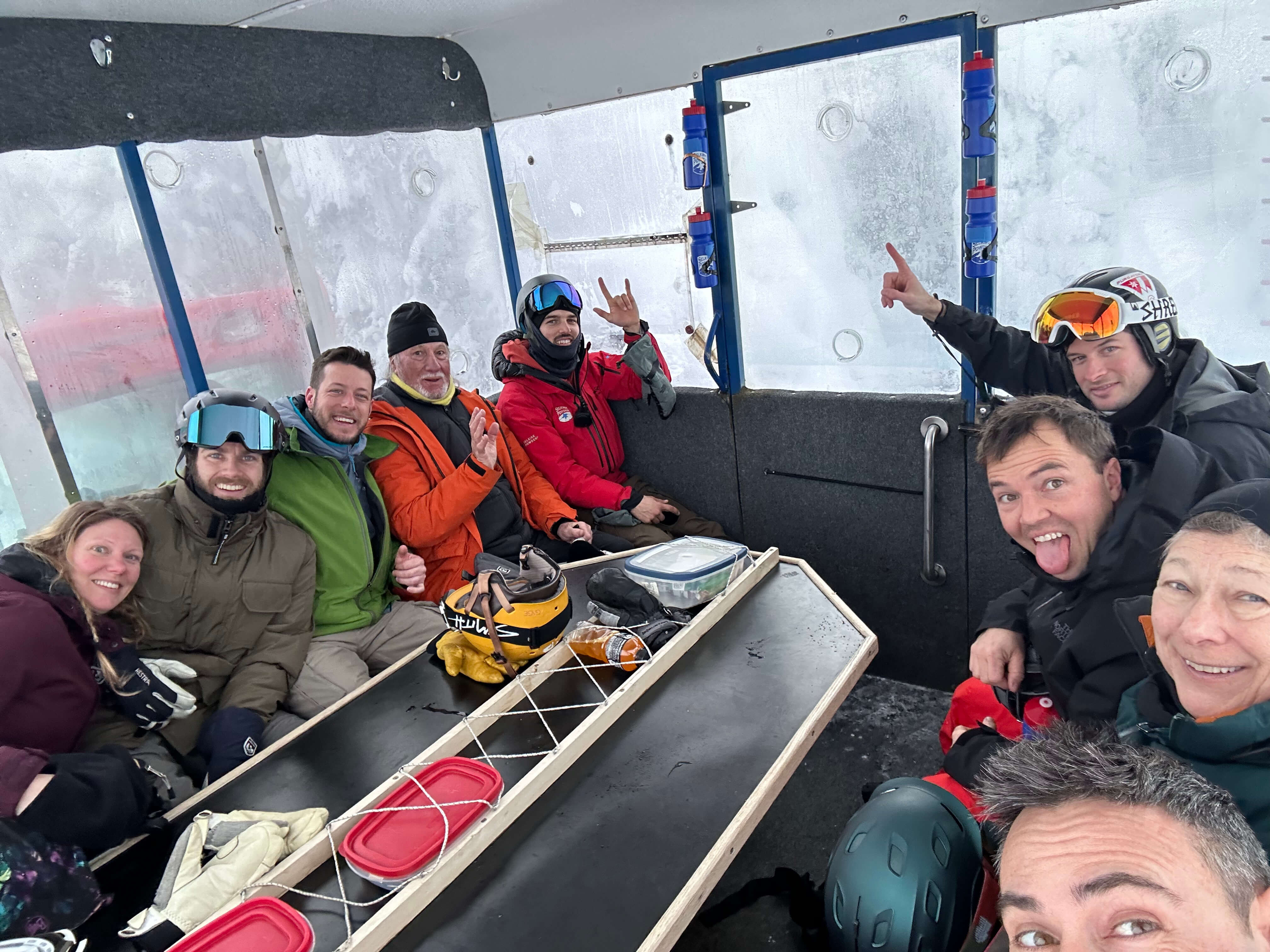 A happy group inside a snowcat
