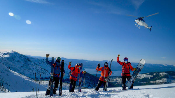 Heli skiing group fly-over