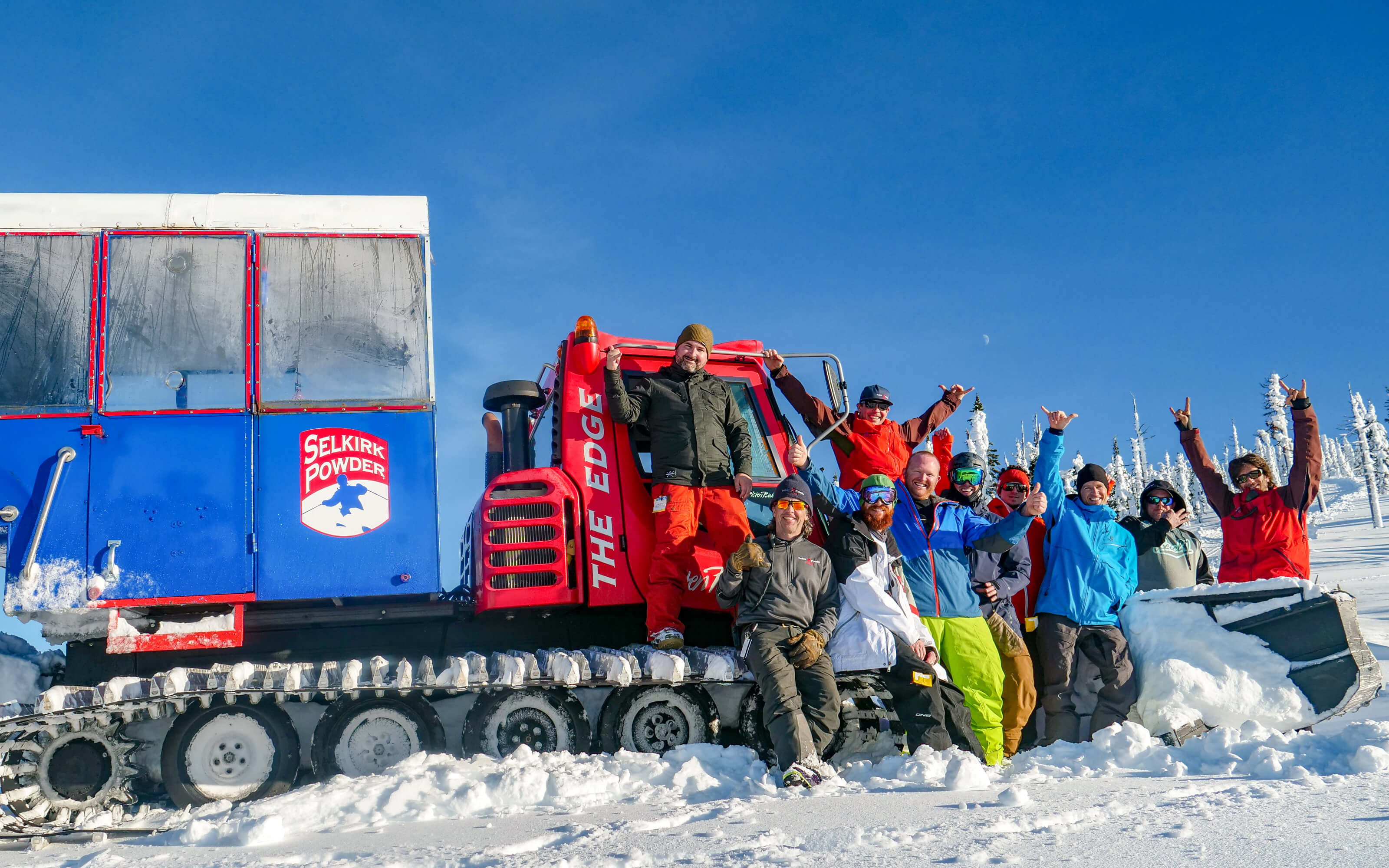 Celebrating in front of a snowcat