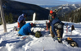backcountry skiing group putting on ski gear