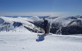 backcountry skier on mountain ridge